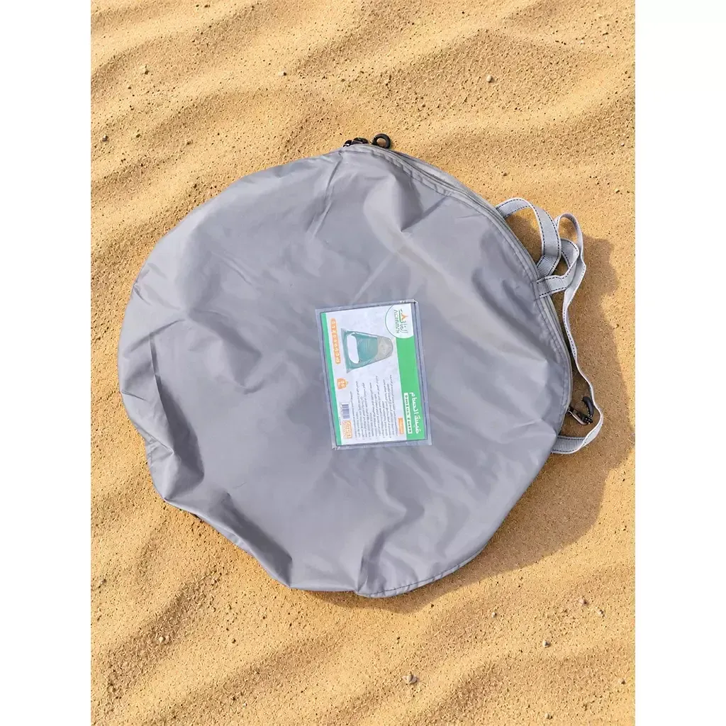 ALGHAFA grey pop-up toilet tent with silver reflective interior and zipped door in the desert