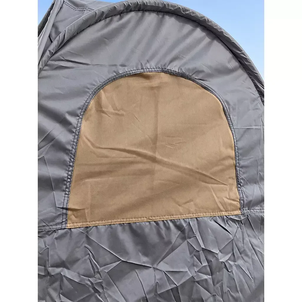 ALGHAFA grey pop-up toilet tent with silver reflective interior and zipped door in the desert