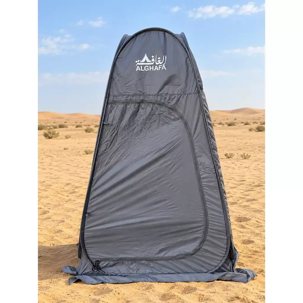 ALGHAFA grey pop-up toilet tent with silver reflective interior and zipped door in the desert