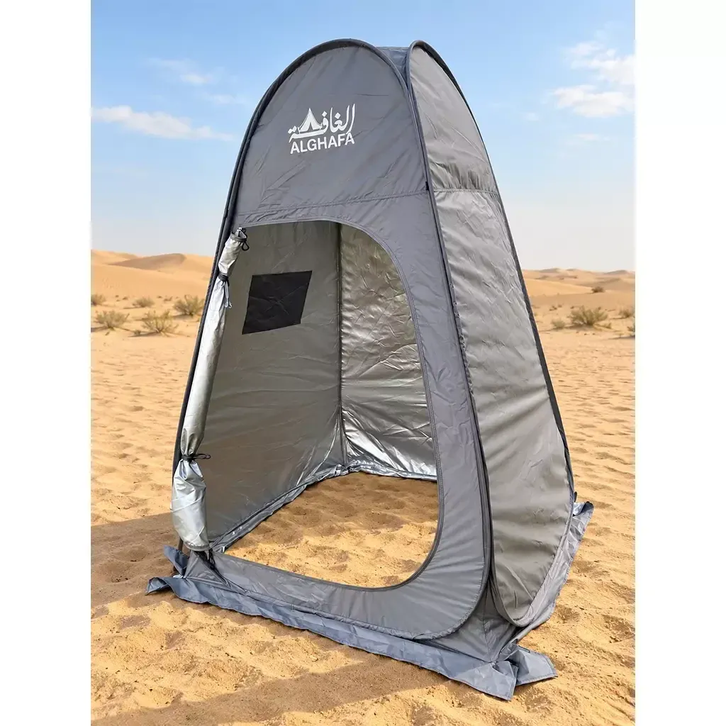 ALGHAFA grey pop-up toilet tent with silver reflective interior and zipped door in the desert