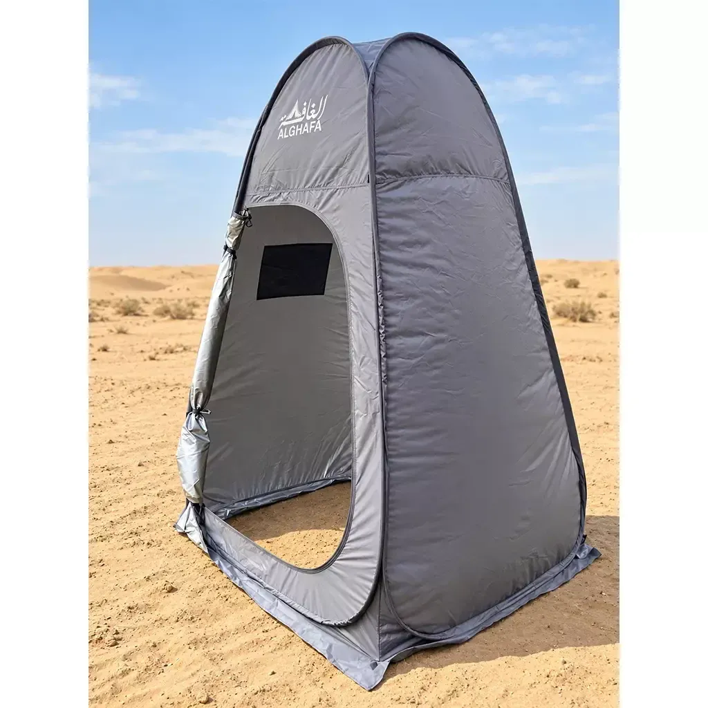 ALGHAFA grey pop-up toilet tent with silver reflective interior and zipped door in the desert